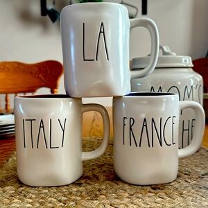 Rae Dunn coffee cup mugs used but in good condition. Set of three.